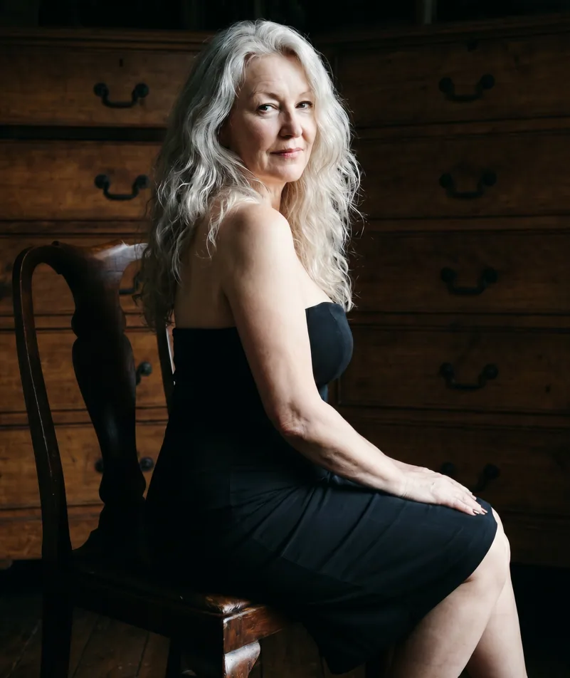 Deirdre, silver-haired woman from Berlin, Germany, sharing her going-gray story