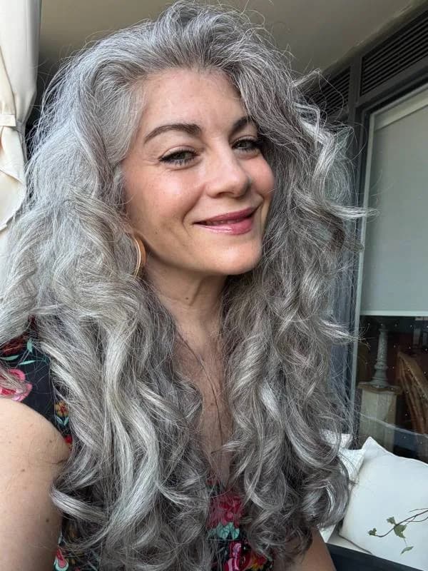 Xaviera, silver-haired woman from Toronto, Canada, sharing her going-gray story