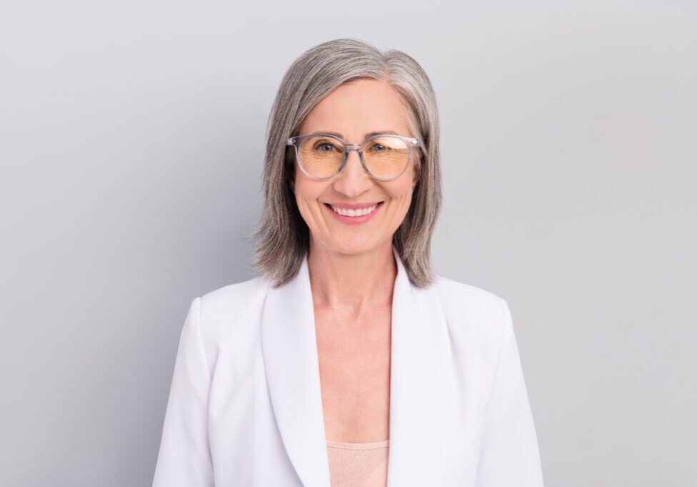Confident woman in professional attire smiling